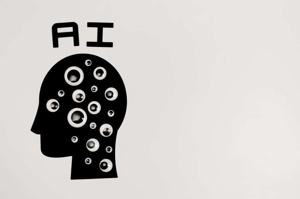 AI concept with a human head silhouette and multiple eyes